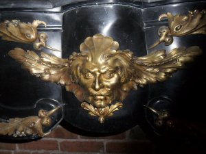 Close up of the mantel's bronze details