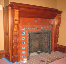 Rock maple mantel with red tile surround