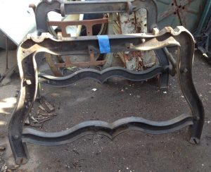 Salvaged industrial saw table stand.