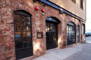 The delicious brick exterior and reclaimed chicken wire glass in the doors and windows of the restaurant are two of its great vintage features