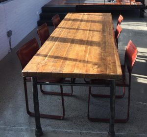 Reclaimed butcher block table with pipe legs