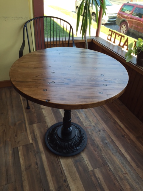 30 in. Wide bistro table made with the industrial flooring wood