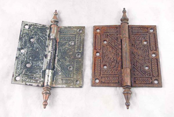 Set of two ornate cast iron door hinges with steeple tips