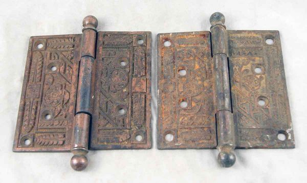 Set of two ornate door hinges with ball tips