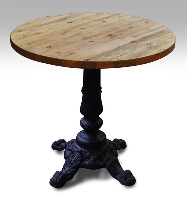 Round Industrial Floor Table with Black Four Footed Ornate Base