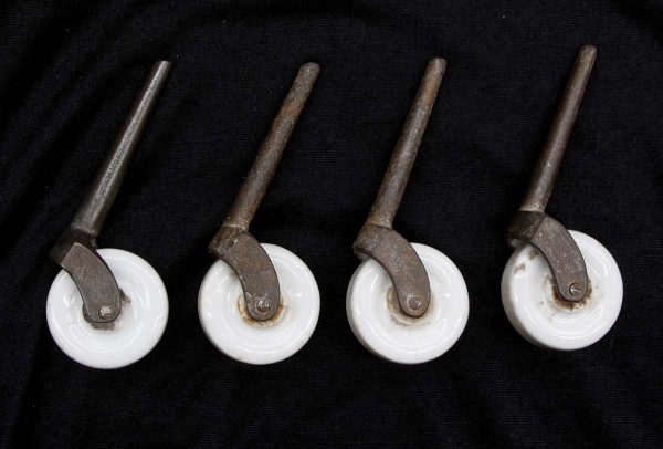 Casters - Set of Antique 1.875 in. White Porcelain Caster Wheels