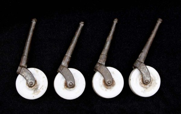 Casters - Set of Antique Porcelain 1.875 in. Steel Peg Caster Wheels