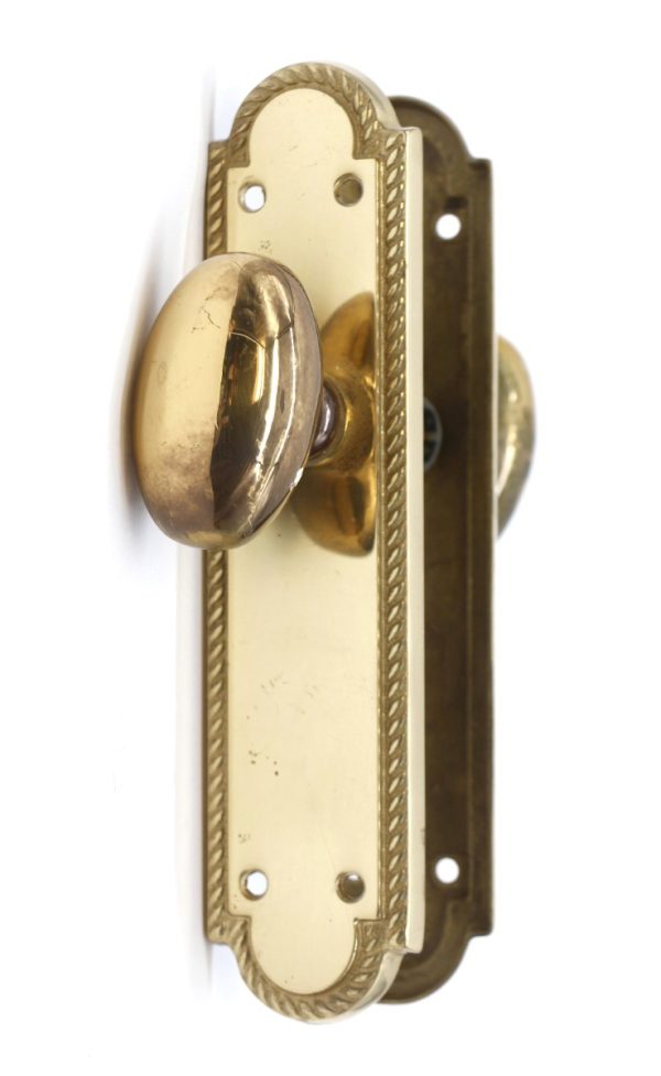 Door Knob Sets - Traditional Braided Edge Polished Brass Oval Door Knob Passage Set