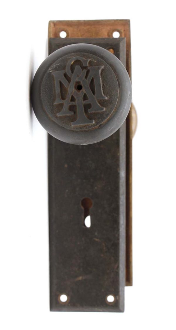 Door Knob Sets - Antique YMCA Emblematic Cast Iron & Plain Brass Door Knob Set